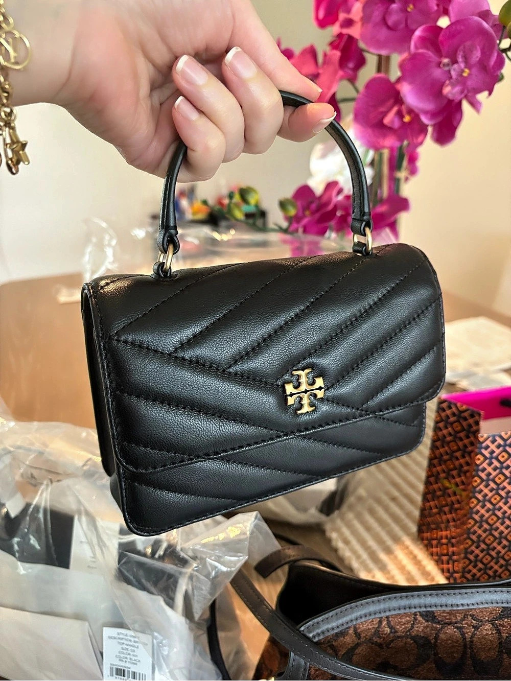 Tory Burch Mini Kira mini top handle  Bag Quilted Black
Nwe with tag